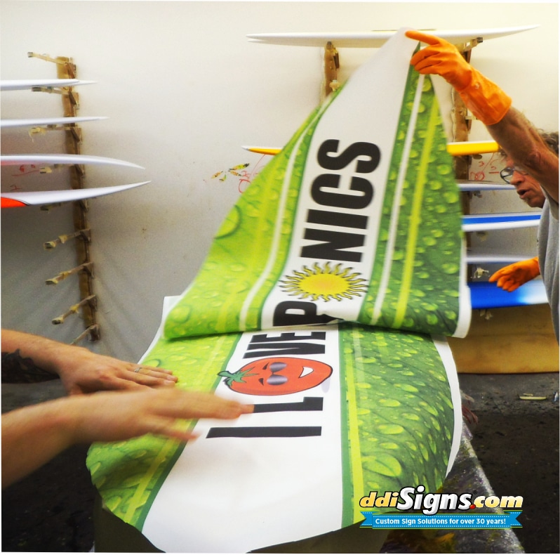 Surfboard inlay being applied